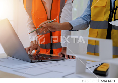Construction and structure concept of Engineer or architect meeting for project working with partner and engineering tools on model building and blueprint in working site, contract for both companies. 119684874