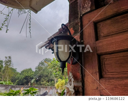 Old Lamp Hanging on The Wall 119686122