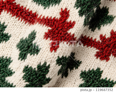 Cozy knitted texture featuring vibrant red and green patterns on a cream background for a festive holiday atmosphere. Textile design concept 119687352
