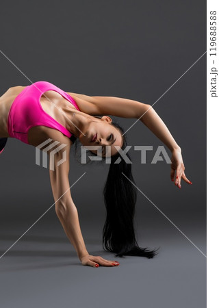 Gorgeous fitness model in pink sportswear shot 119688588