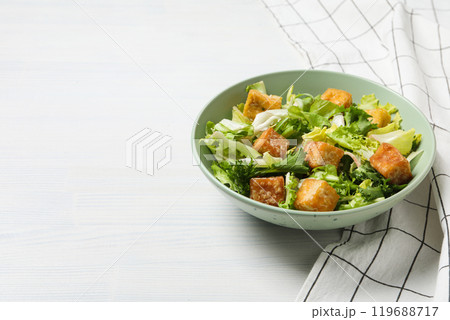 Fried tofu salad in a bowl on a white background 119688717