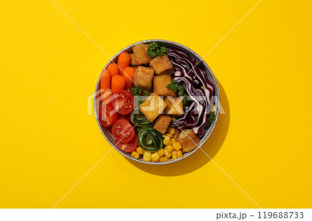 Fried tofu salad in a bowl, top view 119688733