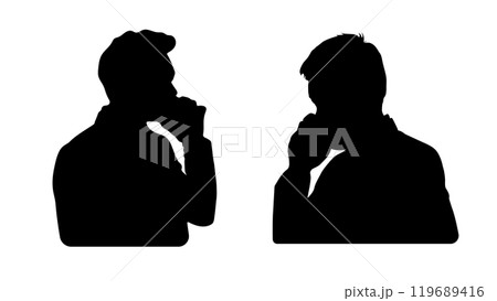 The silhouette of two men on the phone creates a sense of intimacy and connection.The dark and light contrast in the image emphasizes the mystery of the conversation 119689416