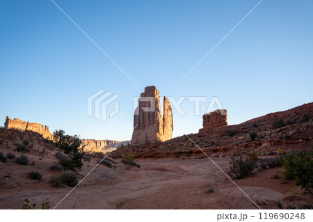 A low-angle view of the Courthouse Towers red rocks in Arches National Park. 119690248