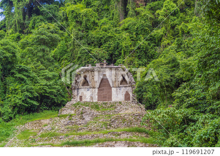 The ancient pyramids of Palenque in Mexico, surrounded by lush jungle. Iconic archaeological site showcasing Mayan culture and history. Travel, history, and adventure concept The ancient pyramids of Palenque in Mexico, surrounded by lush jungle. Iconic archaeological site showcasing Mayan culture and history. Travel, history, and adventure concept 119691207