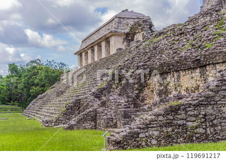 The ancient pyramids of Palenque in Mexico, surrounded by lush jungle. Iconic archaeological site showcasing Mayan culture and history. Travel, history, and adventure concept 119691217
