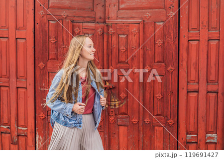 Female tourist in a colonial house in San Cristobal de las Casas, Mexico. Cultural exploration, architecture, and travel experience concept Female tourist in a colonial house in San Cristobal de las Casas, Mexico. Cultural exploration, architecture, and travel experience concept 119691427