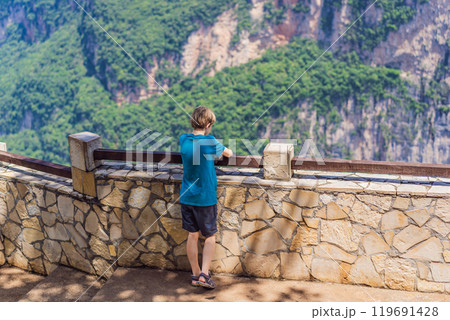 Boy traveler exploring Sumidero Canyon National Park, Mexico. Adventure, natural exploration, and travel experience concept Boy traveler exploring Sumidero Canyon National Park, Mexico. Adventure, natural exploration, and travel experience concept 119691428