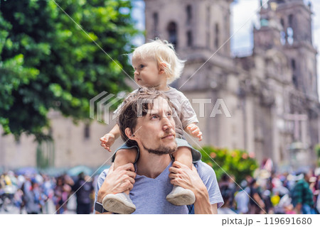 Father and son therists in front of Catedral Metropolitana de la Ciudad de Mexico. Cultural exploration, historic architecture, and travel experience concept Father and son therists in front of Catedral Metropolitana de la Ciudad de Mexico. Cultural exploration, historic architecture, and travel experience concept 119691680