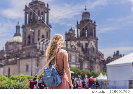 Female tourist in front of Catedral Metropolitana de la Ciudad de Mexico. Cultural exploration, historic architecture, and travel experience concept Female tourist in front of Catedral Metropolitana de la Ciudad de Mexico. Cultural exploration, historic architecture, and travel experience concept 119691760