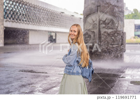 Female tourist exploring the National Museum of Anthropology in Mexico City. Cultural heritage and historical exploration concept Female tourist exploring the National Museum of Anthropology in Mexico City. Cultural heritage and historical exploration concept 119691771