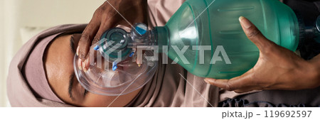 Administering CPR Using Breathing Apparatus 119692597