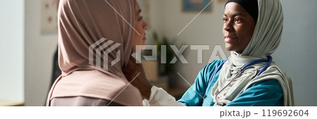 Muslim Female Doctor Examining Patient in Office Setting Muslim Female Doctor Examining Patient in Office Setting 119692604