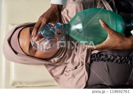 Providing Medical Assistance with Oxygen Mask Providing Medical Assistance with Oxygen Mask 119692761