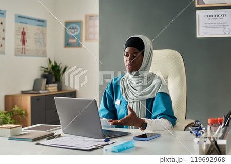 African American Muslim Woman Working in Medical Office Setting 119692968