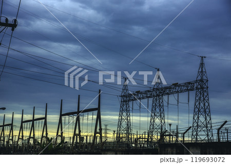 High voltage pole electric wiring distribution landscape energy engineering. Electricity energetic background with blue sky green mountain in countryside. Electric power energy engineering industrial 119693072