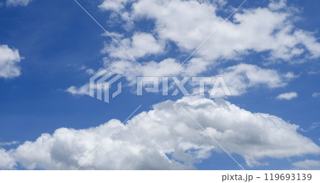 Panorama blue sky clouds pattern on daylight with copy space. Cumulus cloudscape air climate sunny day. Blue sky fluffy white clouds on summer season bright clear skyline with beautiful cloudscape 119693139