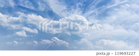 Banner Tropical summer blue sky fluffy white cloud summertime on light sunny day cloudscape. Panoramic Clear bright blue skyline spring sunlight climate background. Heaven blue ecology for web banner 119693227