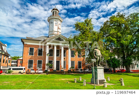 Historic building of Ministry of Finance of Suriname in Paramaribo with a statue of prime minister Johan Adolf Pengel 119697464