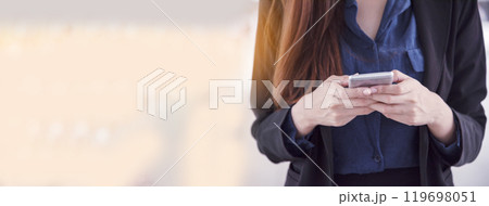 Banner Women sitting on sofa using smartphone, credit card to shopping online with smiling face shopaholics. Panorama Happy asian women lay down use smartphone. Woman online shopping with copy space Banner Women sitting on sofa using smartphone, credit card to shopping online with smiling face shopaholics. Panorama Happy asian women lay down use smartphone. Woman online shopping with copy space 119698051