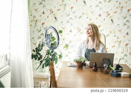 blogger recording a session for social media, emphasizing engagement and follower interaction with ring lamp, smartphone blogger recording a session for social media, emphasizing engagement and follower interaction with ring lamp, smartphone 119698329