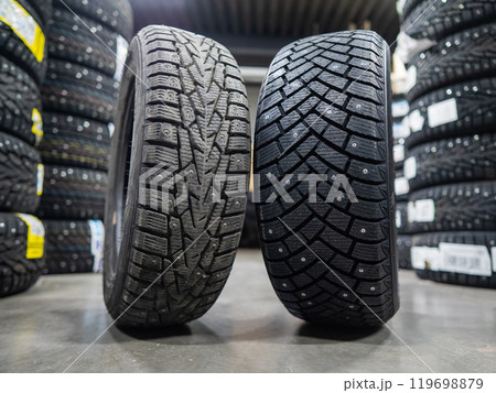 Comparison of old and new studded car tires. Comparison of old and new studded car tires. 119698879