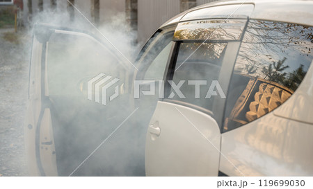 Smoke is coming from inside the car. Smoke is coming from inside the car. 119699030
