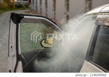 Smoke is coming from inside the car. Smoke is coming from inside the car. 119699060