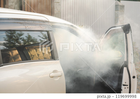Smoke is coming from inside the car. Smoke is coming from inside the car. 119699998