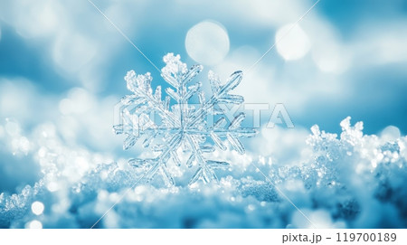 Close-up of a snowflake sparkling in the snow with blue tones. Perfect for winter and Christmas backgrounds. 119700189
