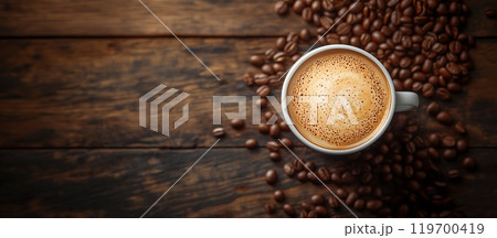 A white cup of hot cappuccino with coffee beans stands on a wooden background. Rustic style, space for text A white cup of hot cappuccino with coffee beans stands on a wooden background. Rustic style, space for text 119700419