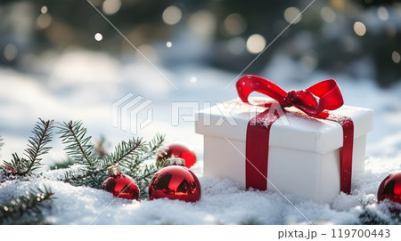Festive Christmas scene with gift boxes in a snowy setting, ideal for holiday promotions. 119700443