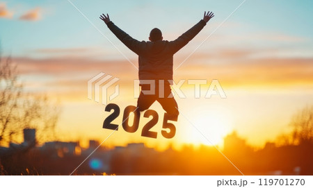 A man jumps joyously with the numbers '2025' at a golden sunrise, symbolizing optimism and excitement for the New Year. A man jumps joyously with the numbers '2025' at a golden sunrise, symbolizing optimism and excitement for the New Year. 119701270
