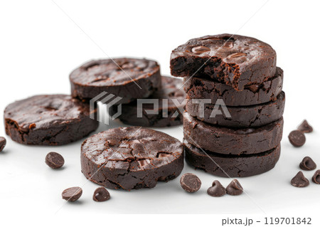 Stacks of chocolate brownie cookies with chocolate filling on a white background. 119701842