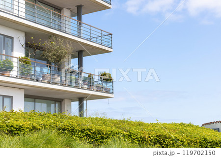 Large balconies against the blue sky. Real estate investment concept. 119702150