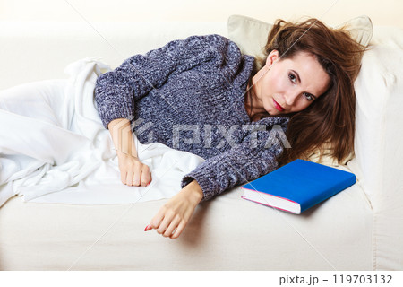 Woman taking power nap after lunch Woman taking power nap after lunch 119703132