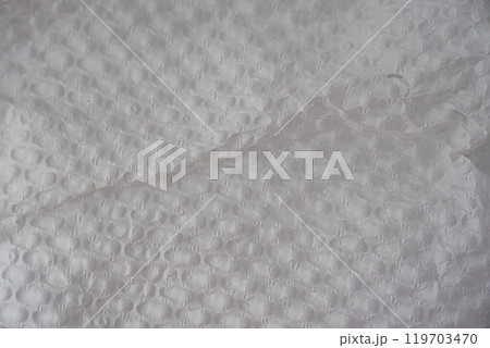 Recycled perforated white paper close up texture Recycled perforated white paper close up texture 119703470