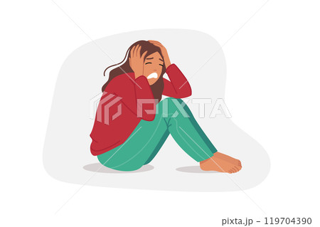 Upset woman is crying, sitting on floor and clutching head, due to panic attack or personal burnout 119704390