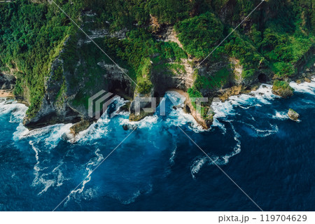Landscape with rocks and blue ocean with waves in Indonesia. Above view. 119704629