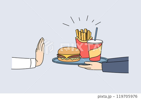 Refusal from fast food and harmful products demonstrated by hand of man, rejecting tray with burger Refusal from fast food and harmful products demonstrated by hand of man, rejecting tray with burger 119705976