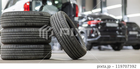 Changing tires for a car according to the season. Changing tires for a car according to the season. 119707392