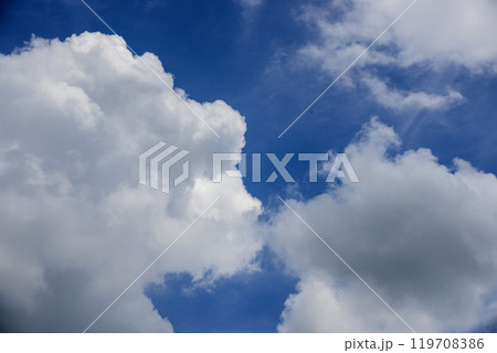 Blue sky fluffy white clouds on summer season bright clear skyline with beautiful cloudscape. Panorama blue sky clouds pattern on daylight with copy space. Cumulus cloudscape air climate sunny day 119708386