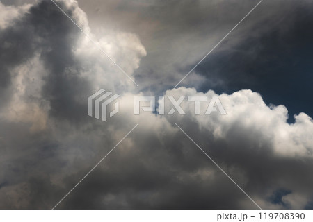 Dramatic dark storm rain clouds black sky background. Dark thunderstorm clouds rainny atmosphere. Meteorology danger windstorm disasters climate. Dark cloudscape storm disaster gloomy gray cloud sky 119708390