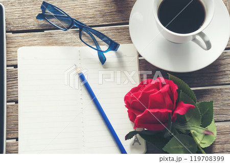 Top view office desk smart tablet document paper, coffee cup roses on wood table with copy space. Tabletop notebook office empty blank white paper pen coffee cup to display workspace wood background 119708399