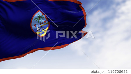 Guam national flag waving in the wind on a clear da 119708631