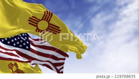 Close-up view of the New Mexico and United States flags waving 119708635