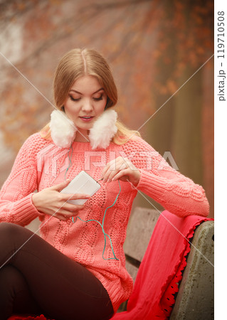 Smiling lady with headphones. 119710508
