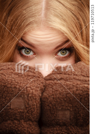 beauty face woman in warm clothing outdoor 119710513