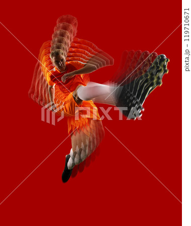 High-energy soccer action collage featuring male athlete in motion, captured mid-kick against vibrant red background. High-energy soccer action collage featuring male athlete in motion, captured mid-kick against vibrant red background. 119710671
