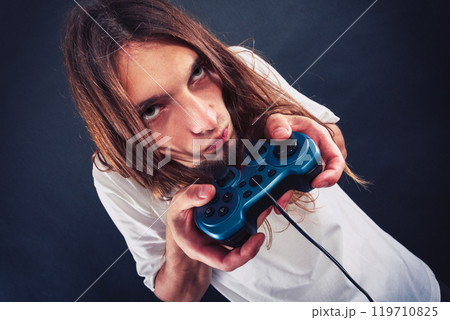Male player focus on play games 119710825